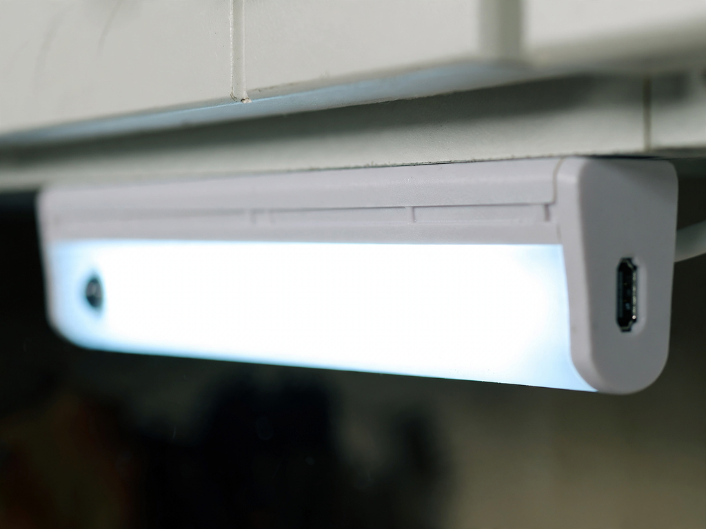 Close-up of the light bar showing the motion sensor and Micro USB charging port