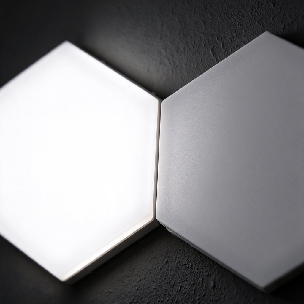 Close-up of two Aetheris Hexagon Light Panels lit cool white